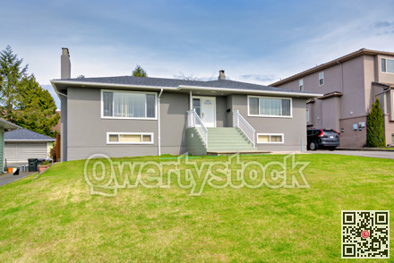Average residential house with landscaped front yard in Canada