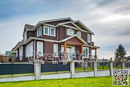 Luxury family house on cloudy sky background
