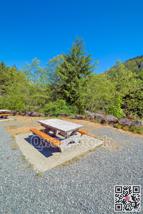 Rest area with concrete table on a hiking route