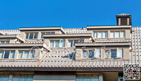 Top level of the building with residential mansard roof