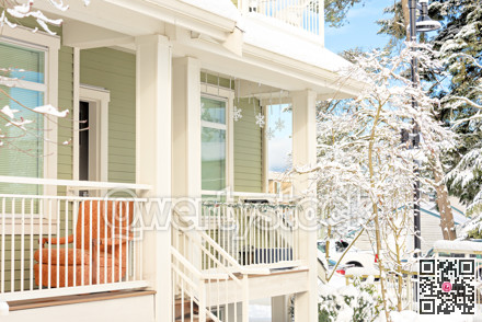 Residential townhouse patio on bright winter day and blue sky background