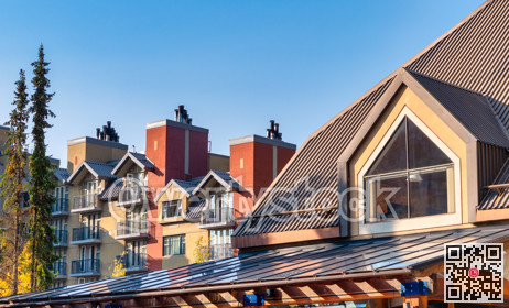 Top of resort residential buildings in sunset light rays