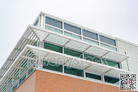 Icicles of freezing rain over weather shelds of an office building