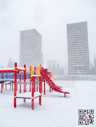 Children's play ground in snow on winter season in Canada