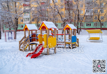 Children's play ground in snow on winter season