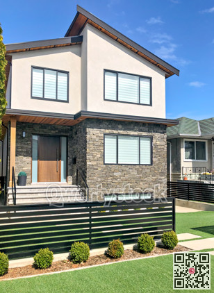 Residential family house with concrete pathway over front yard