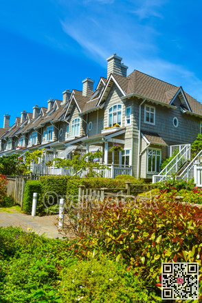 Residential townhouses on sunny day in Vancouver, British Columbia, Canada.