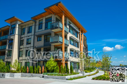 Brand new apartment building on sunny day in British Columbia, Canada.