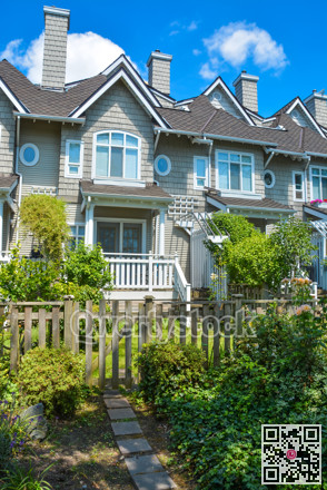 Residential townhouses on sunny day in Vancouver, British Columbia, Canada.