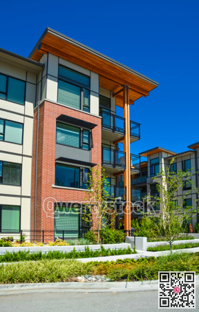 Brand new apartment building on sunny day in British Columbia, Canada.