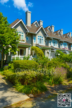Residential townhouses on sunny day in Vancouver, British Columbia, Canada.