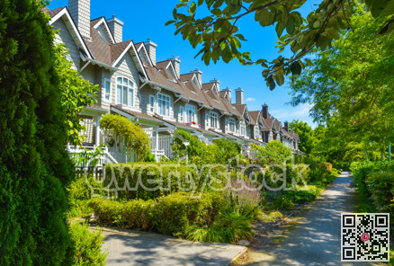 Residential townhouses on sunny day in Vancouver, British Columbia, Canada.