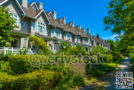 Residential townhouses on sunny day in Vancouver, British Columbia, Canada.