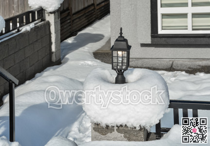 Street light in snow. Small architecture form.