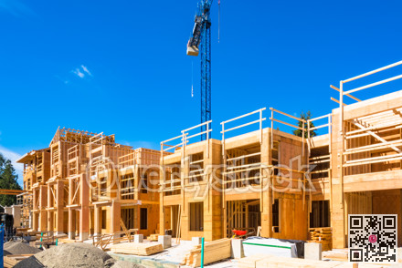 New residential building under construction with the crane above