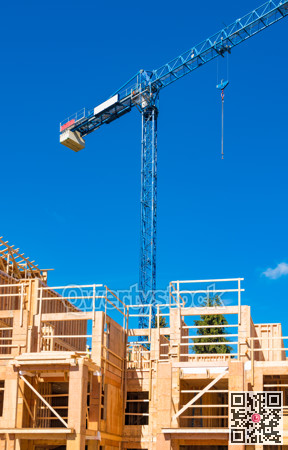 New residential building under construction with the crane above
