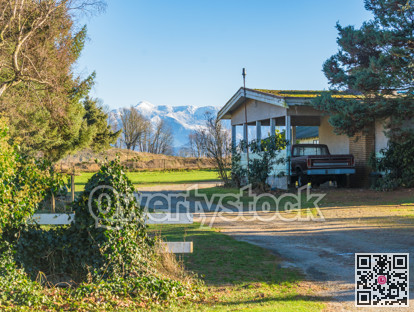 Back yard of family house with old truck parked beside