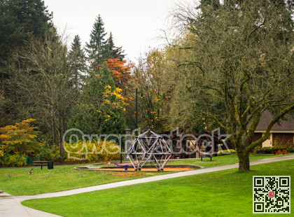 Small playground in a park on overcast autumn day in Canada