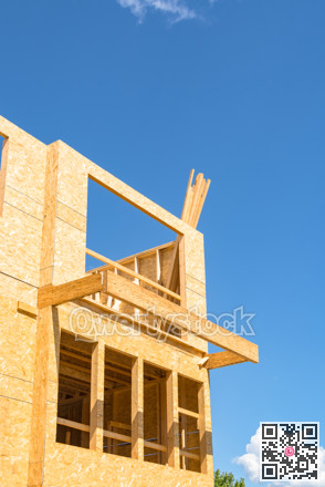 New residential building under construction on blue sky background