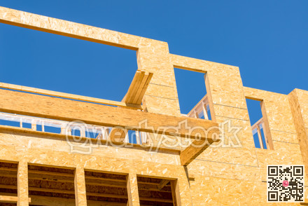 New residential building under construction on blue sky background
