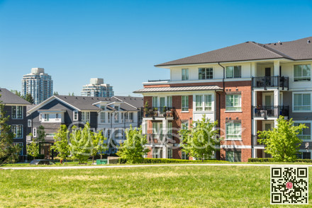 Brand new apartment building on sunny day in British Columbia, Canada.