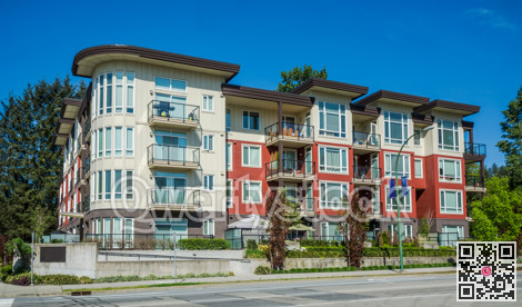 New apartment building on sunny day in British Columbia, Canada.