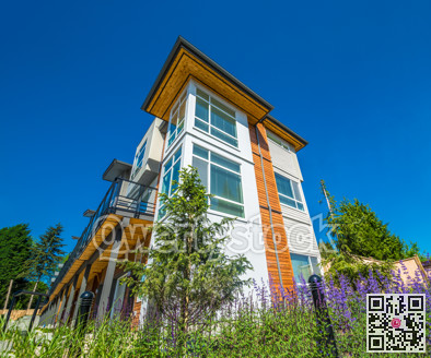 Brand new townhouse complex on sunny day in British Columbia.