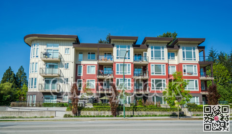 New apartment building on sunny day in British Columbia, Canada.