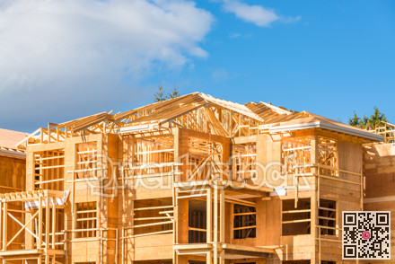 New apartment building under construction on blue sky background