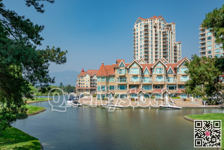 Luxury residential building with boat pier at the entrance in British Columbia.