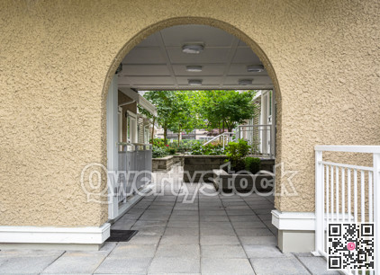 Entrance arch to inner yard of residential complex.