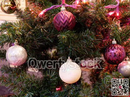 White and magenta Chistmas tree baubles closeup look.
