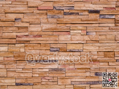 Decorative brown stone setting. Cut stone wall texture.