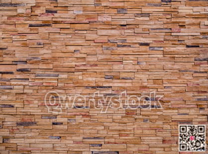 Decorative brown stone setting. Cut stone wall texture.