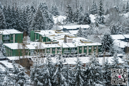 Campus of low-rise buildings covered in snow