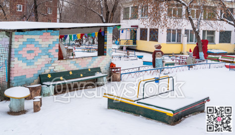 Pre-school playground in snow on winter season.