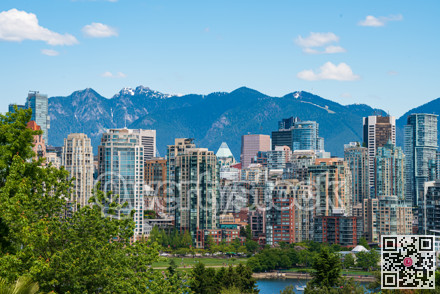 Vancouver downtown overview with sky and mountain background.