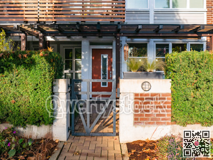 Pathway to residential entrance on sunny day in British Columbia