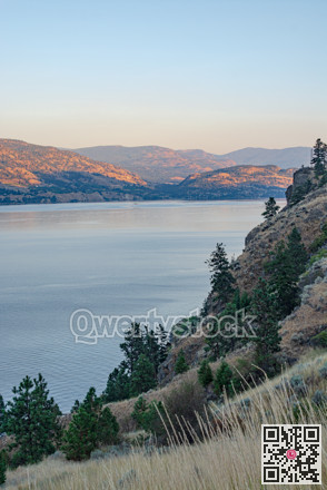 Scenery overview of Okanagan lake on summer sunset
