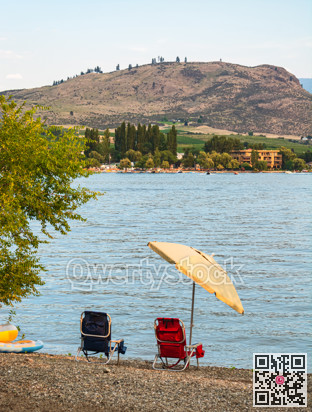 Small tourist camp with a lake overview on warm summer evening.