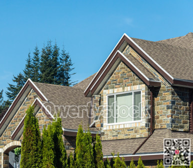 Window on upper level of residential building on skay background