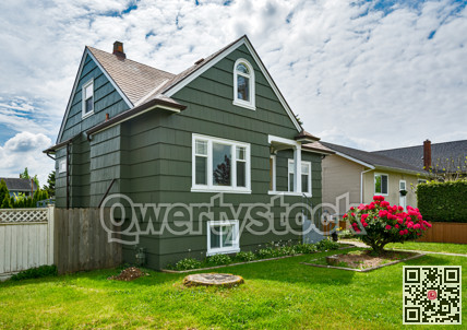 Old but neat residential house with concrete pathway to the entrnace