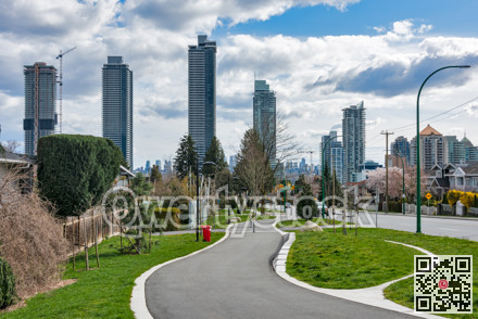 Cityscape of Vancouver on cloudy sky background