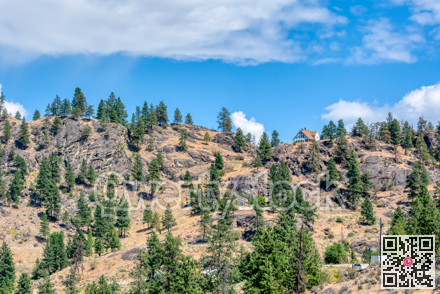 Mountain landscape with residential houses on hot summer day