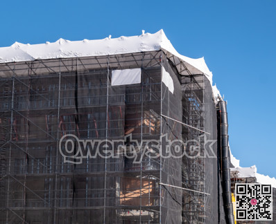 Office building under construction on blue sky background
