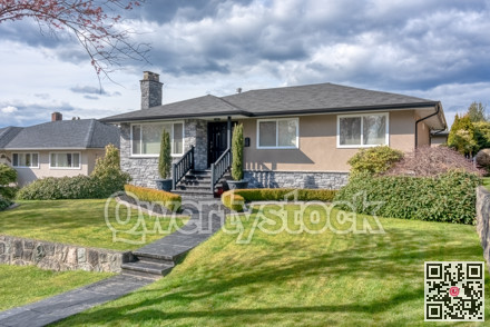 Family residential house on sunny day on cloudy sky background