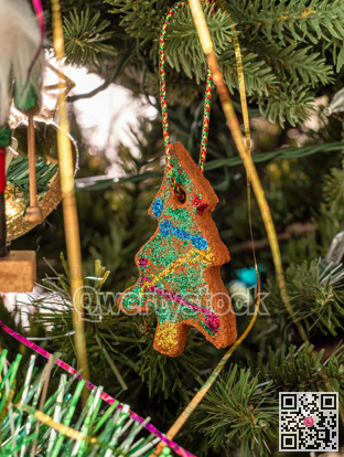 Ginger bread cookie tree decoration on Christmas tree brench