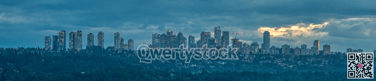 Panoramic view of Metrotown cityscape on cloudy sky background
