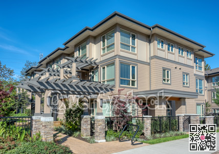 Building of residential townhouses on a sunny day