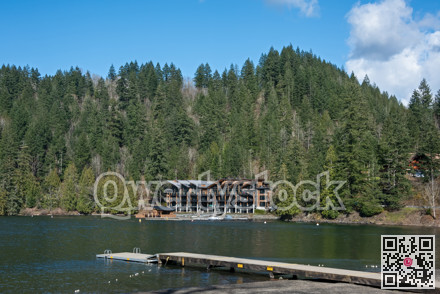 Lake overview with small panton pier and water front resort building